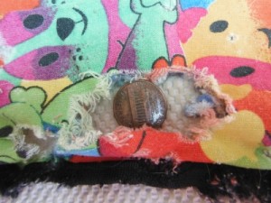 This chewed up hammock is now used as a warming blanket, wrapped around our older rats after they have had a bath. Because we are holding them while they are using the blanket, we can properly supervise the use of the newly purposed hammock and prevent strangling on the unsafe opening.